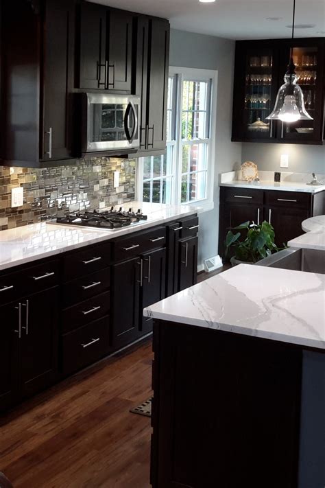 dark cabinets light countertops backsplash